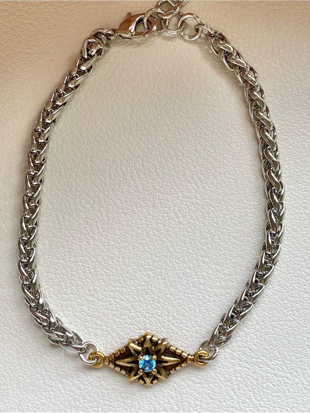 Gold Accent Silver Chain Bracelet with Blue Stone